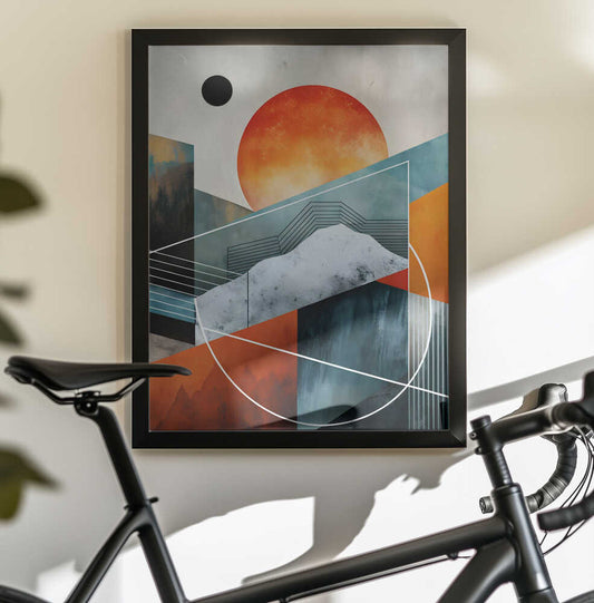 Abstract Horizons by Miguel Bruzual, black-framed artwork above a bicycle; an orange sun above angular teal mountains crossed by fine white geometric lines.
