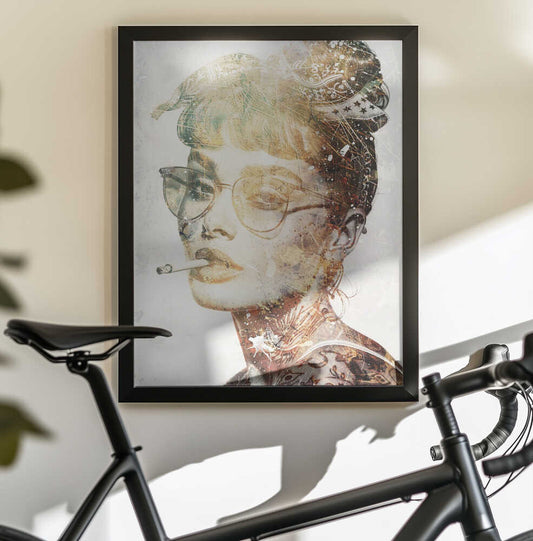 Audrey 01 by Rafal Kulik, black-framed artwork above a bicycle; a vintage-style face in glasses with an ornate updo and sepia decorative overlays.