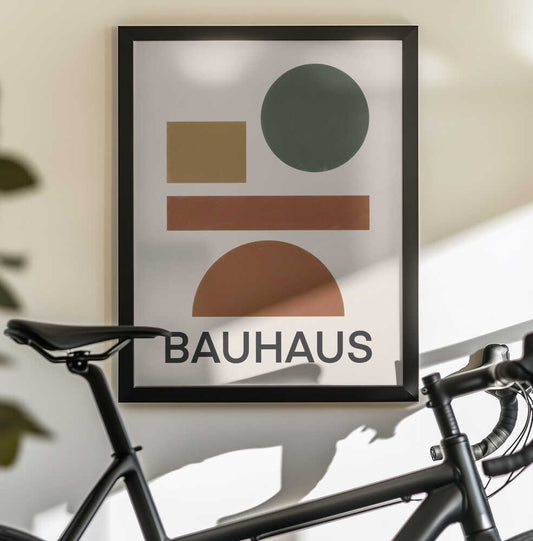Bauhaus Geometric minimal 04 by Little Dean, black-framed artwork above a bicycle; a green circle, ochre square, rust bar and brown semicircle above BAUHAUS lettering.