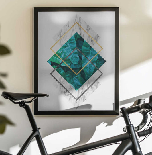 Botanical and geometric Shape by Vitor Costa, black-framed artwork above a bicycle; layered teal botanical diamonds with fine gold-colored and gray geometric outlines.