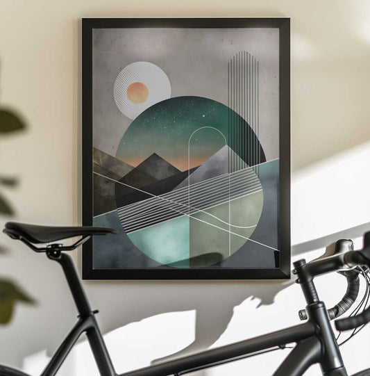 Celestial Geometry by Miguel Bruzual, black-framed artwork above a bicycle; layered mountain shapes within teal circles crossed by fine white and black lines.