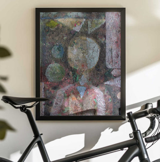 Dandelion Man by Marina Nelson — black-framed canvas displayed behind a bicycle