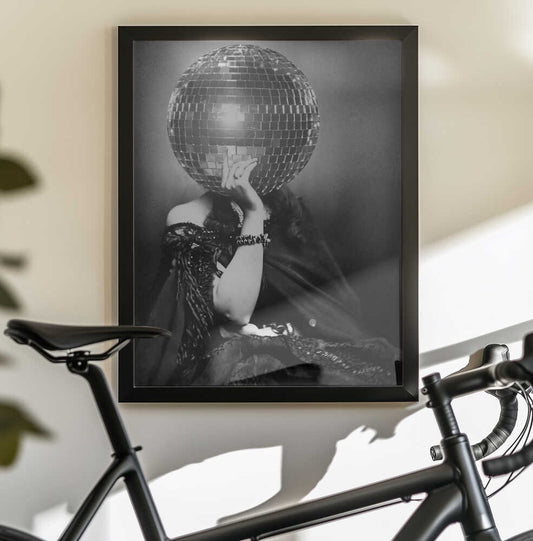 DISCO VINTAGE WOMAN by The Art Concept — black-framed canvas displayed behind a bicycle