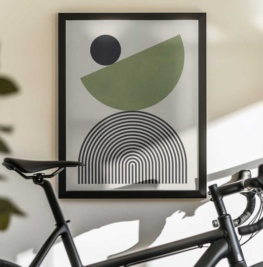 Geometric Shapes with a Black Circle by Vitor Costa, black-framed artwork above a bicycle; a black circle above a tilted green semicircle and fine nested black arches.