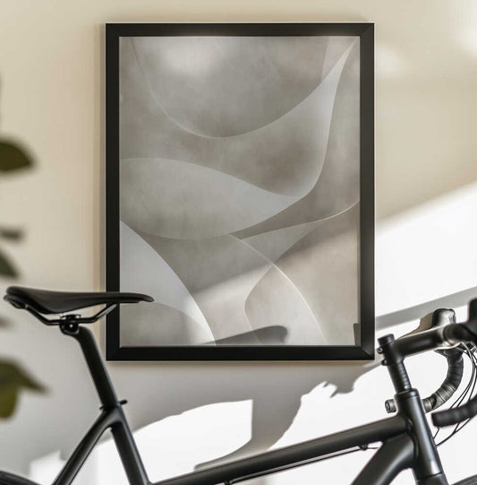Green Abstract 7 by Bilge Paksoylu, black-framed artwork above a bicycle; overlapping pale curved planes with soft gray-green and warm neutral shading.