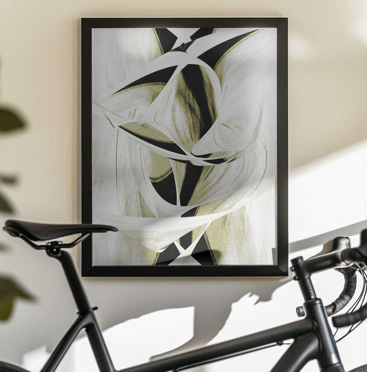 Intertwined Shapes And Monochromatic Tones by Christina Sillen, black-framed artwork above a bicycle; intertwined white ribbons and black angular shapes with muted olive accents.