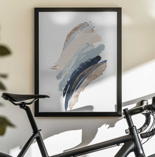 Smooth Shapes-1 by Sally Ann Moss, black-framed artwork above a bicycle; sweeping blue and beige brush-like shapes on white.