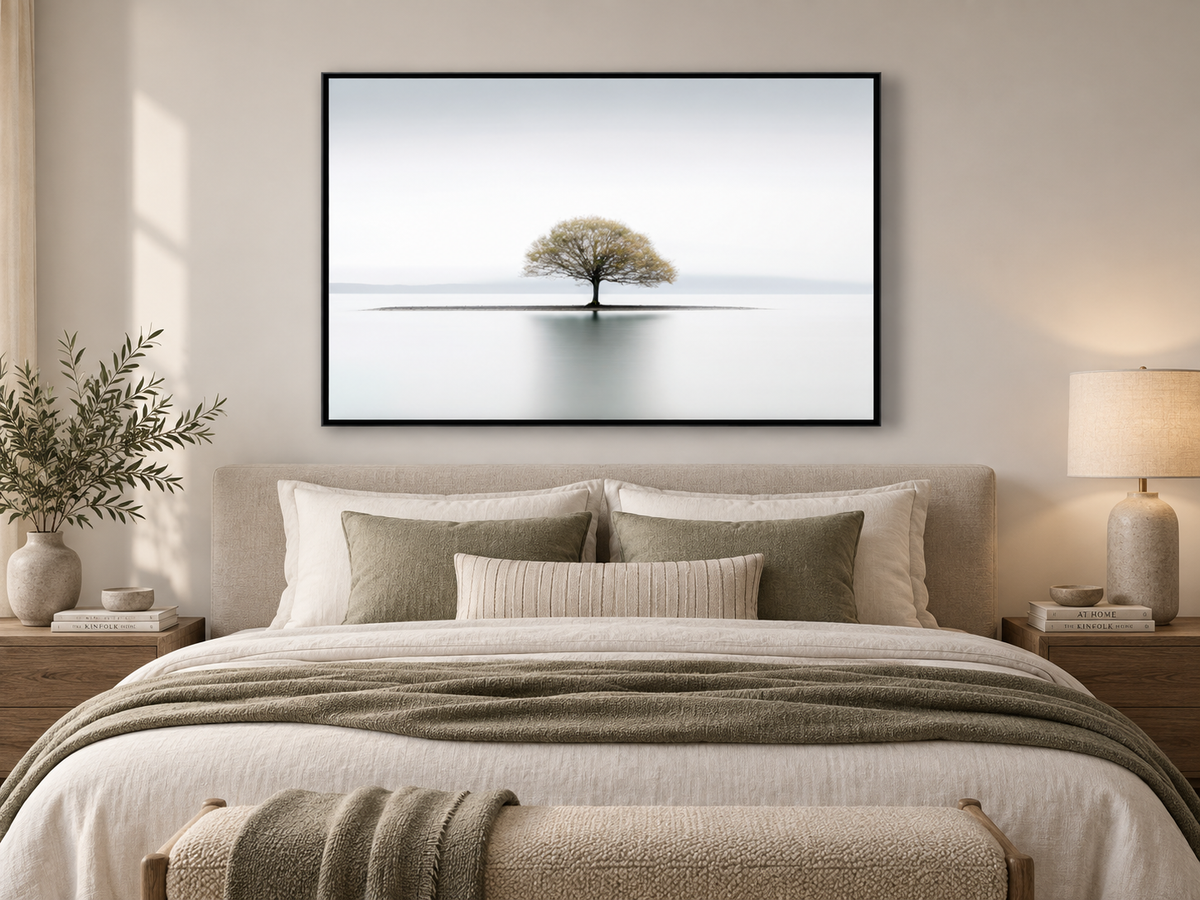 Still | Canvas Print | Minimalist Tree Landscape Wall Art — black-framed canvas above a bed
