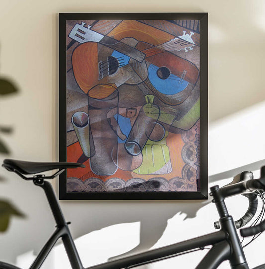 Two Guitars by Ricardo Maya, black-framed artwork above a bicycle; two overlapping guitars above geometric vessels and patterned trim.