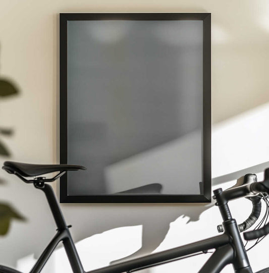 Without End by Mark Russell Jones — black-framed canvas displayed behind a bicycle