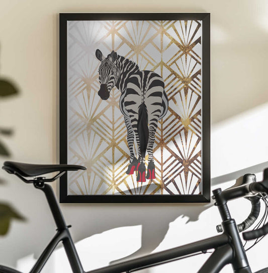 Zebra Heels Art Deco by Sarah Manovski, black-framed artwork above a bicycle; a zebra in red high heels against a pale gold-toned Art Deco fan pattern.