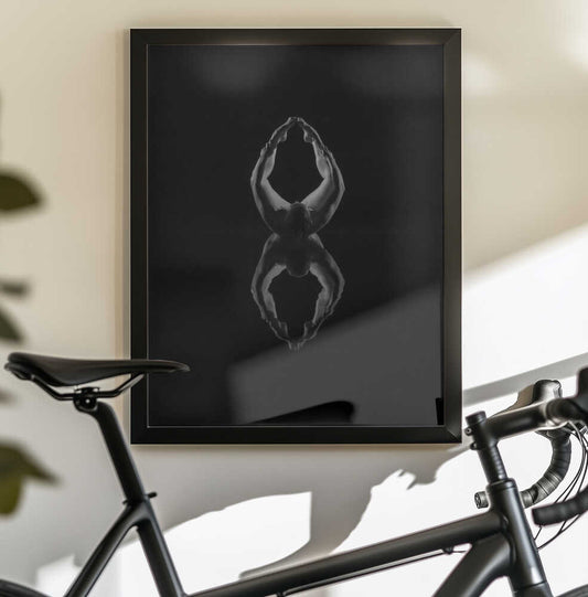 8 by Leszek Paradowski, black-framed artwork above a bicycle; monochrome figure with raised arms and a mirrored reflection.