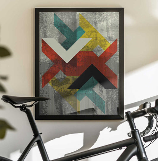 Abstract Geometric Pattern by Petr Strnad, black-framed artwork above a bicycle; layered red, teal, yellow and black chevrons over a weathered gray field.