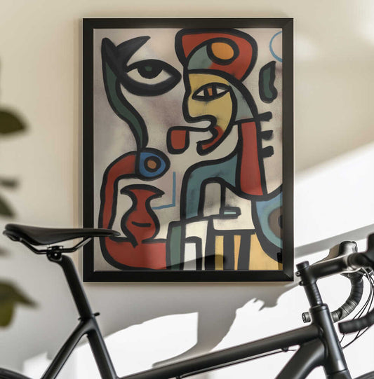 Abstract Visions by Little Dean, black-framed artwork above a bicycle; interlocking abstract faces outlined in black with warm color.