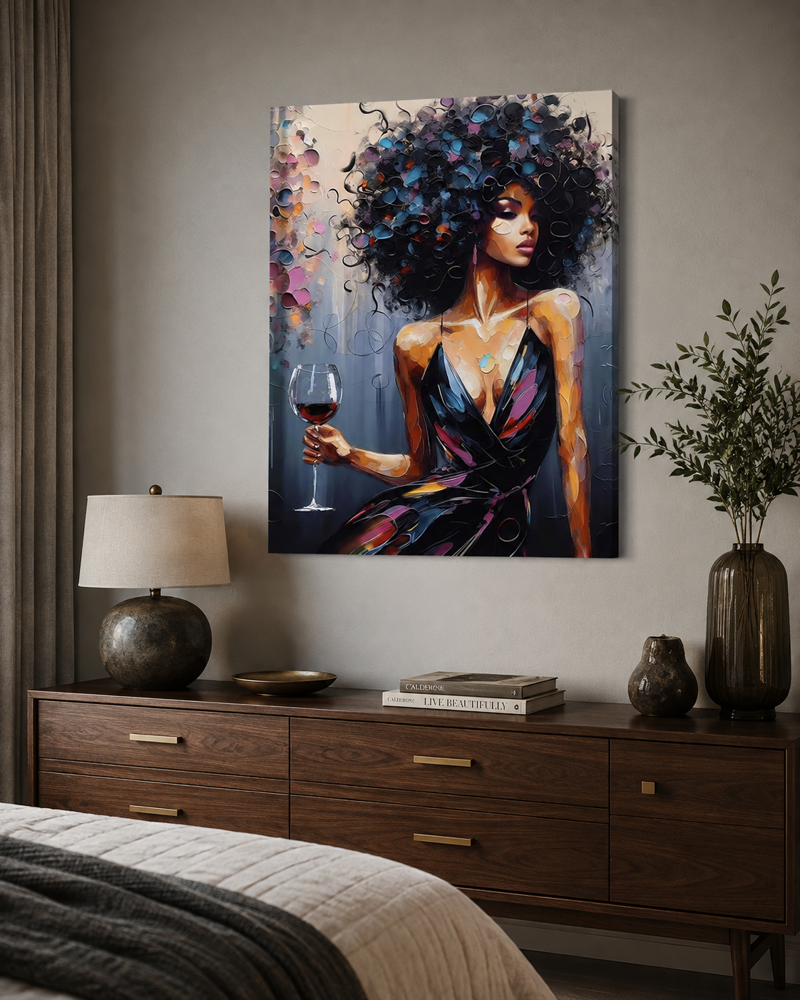 A vertical canvas art print depicting a woman with voluminous dark hair holding a glass of red wine, styled on a gray wall above a wooden nightstand in a modern bedroom setting.