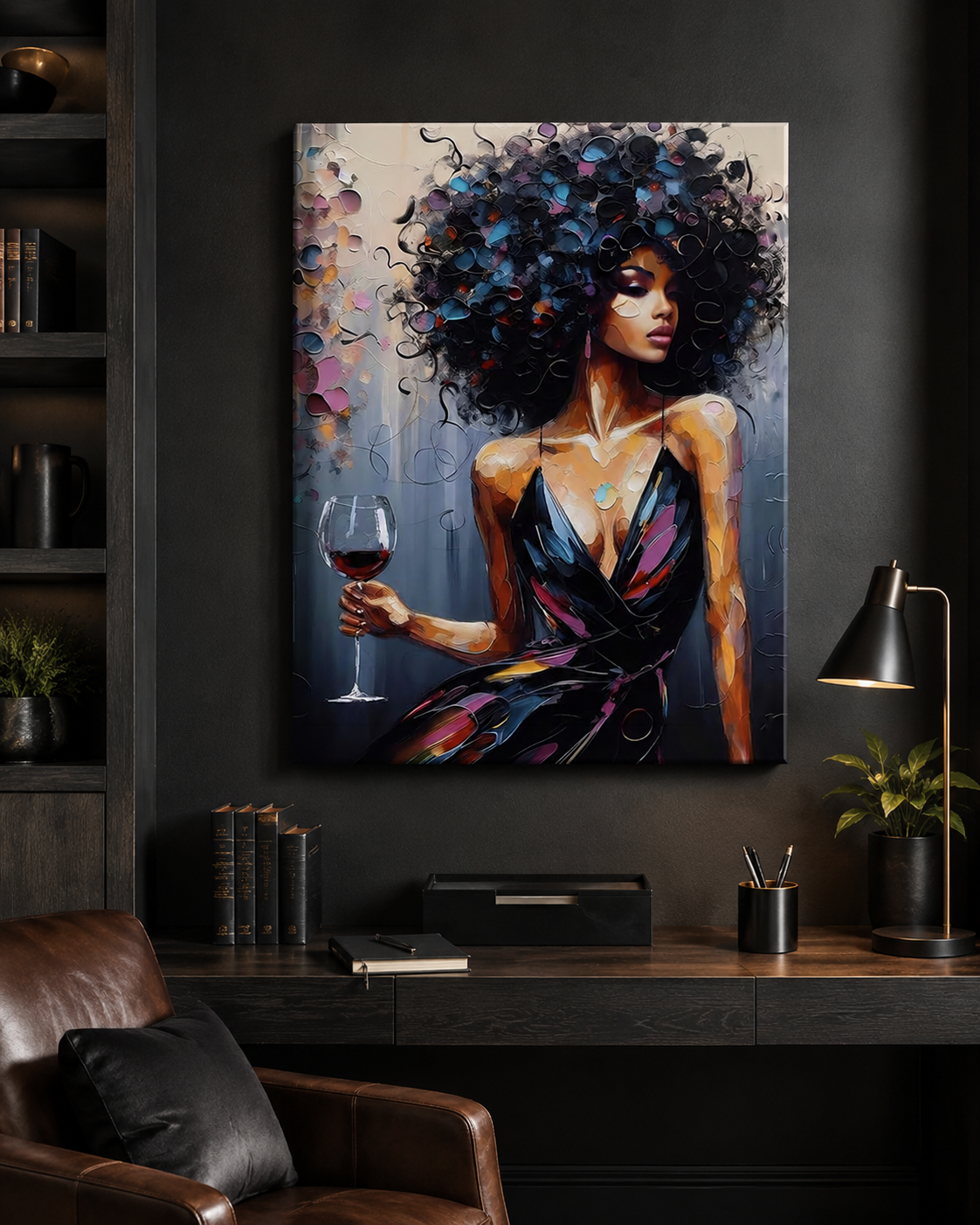 A large vertical canvas art print depicting a woman with voluminous dark hair holding a glass of red wine, displayed on a dark gray wall above a desk in a modern home office setting.