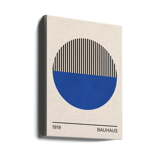 Bauhaus art 1 by Vitor Costa, gallery-wrapped canvas viewed at an angle; a circle with a striped black upper half and solid blue lower half above Bauhaus lettering.