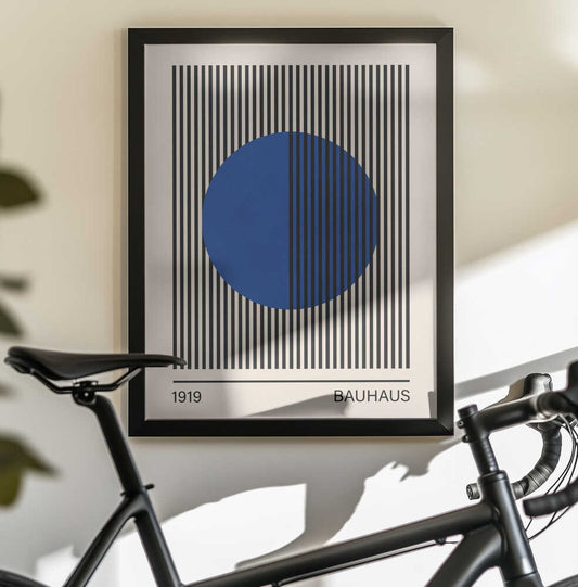 Bauhaus art 3 by Vitor Costa, black-framed artwork above a bicycle; a blue circle intersecting a rectangular field of black vertical stripes.