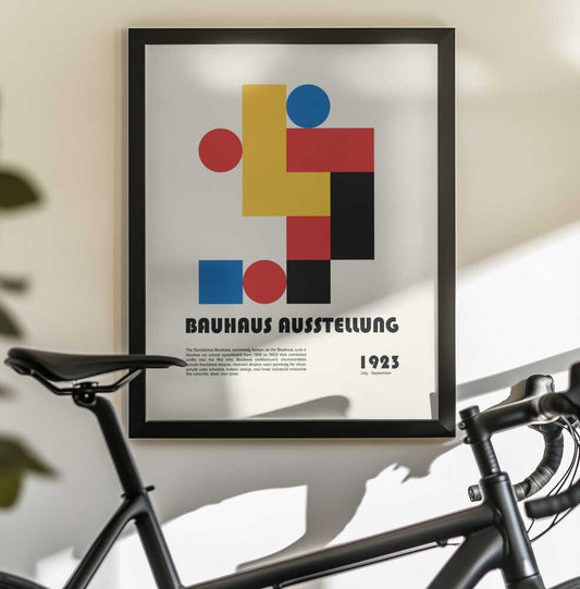 Bauhaus Ausstellung by Retrodrome, black-framed artwork above a bicycle; primary-color circles and rectangles with Bauhaus lettering.