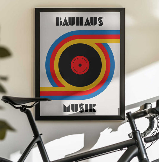 Bauhaus Musik Vinyl by Retrodrome, black-framed artwork above a bicycle; black vinyl record with red, yellow and blue curved bands.