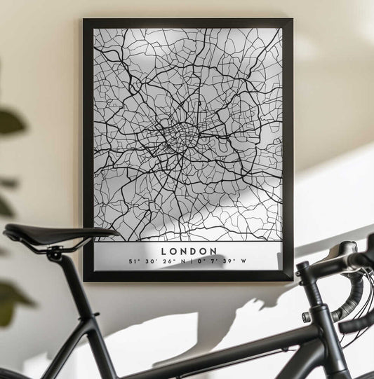 Black Maps 41 by Emiliano Deificus, black-framed artwork above a bicycle; black and white London street map with city label.