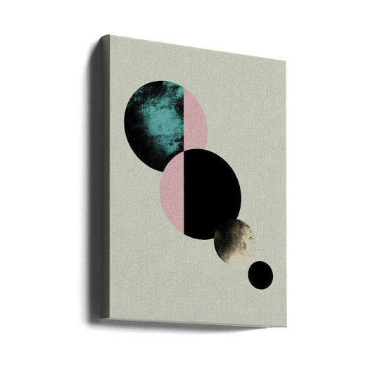 Celestial Circles by Emanuela Carratoni, gallery-wrapped canvas viewed at an angle; split teal, pink and black circles descending toward smaller gray discs.