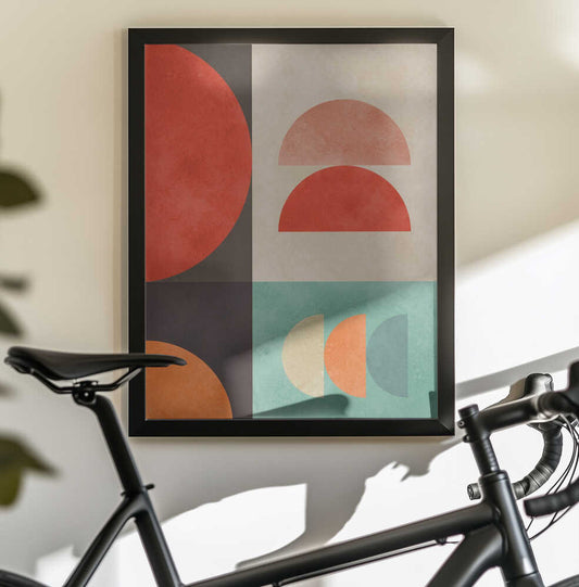 Circles in Harmony 11 by Vitor Costa, black-framed artwork above a bicycle; red and pink semicircles with cream, orange and teal forms in a vertical geometric layout.