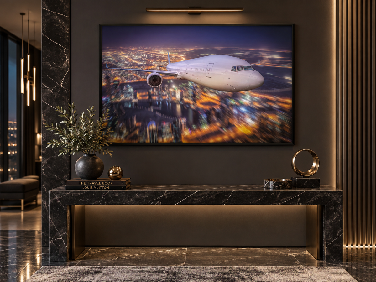 City Lights Flight | Canvas Print | Aviation Night Photography Wall Art — black-framed canvas above a bench