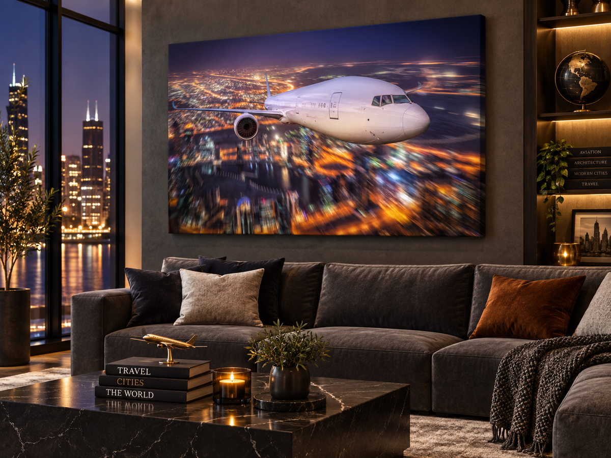 City Lights Flight | Canvas Print | Aviation Night Photography Wall Art — black-framed canvas above a sofa