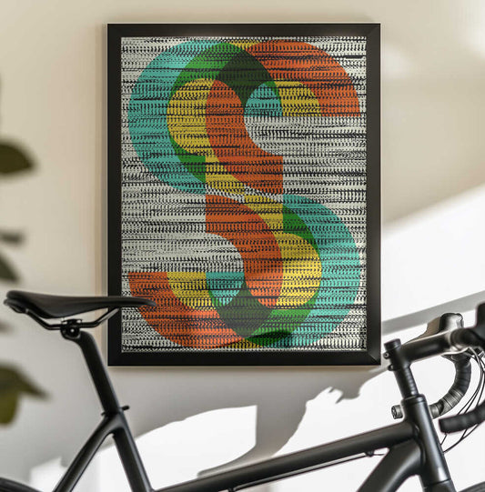 Colorful Stripe Illusion by Petr Strnad, black-framed artwork above a bicycle; orange, green and yellow looping shapes over dense black-and-white horizontal marks.
