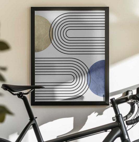 Curves and Circles by Vitor Costa — black-framed canvas displayed behind a bicycle