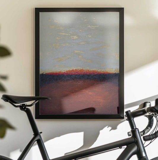 Deep Emergence by Alyson Storms — black-framed canvas displayed behind a bicycle