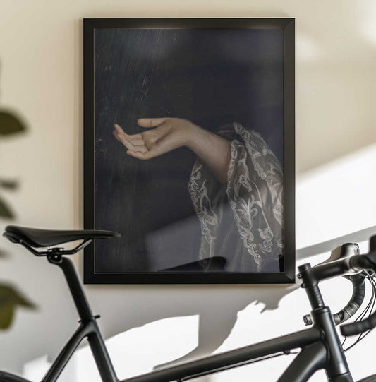 Detail Of Woman / Oil Painting by The Art Concept — black-framed canvas displayed behind a bicycle