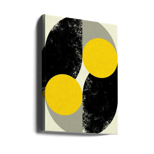 Duality in Motion by Petr Strnad, gallery-wrapped canvas viewed at an angle; two yellow circles crossing opposing black and gray curved fields.