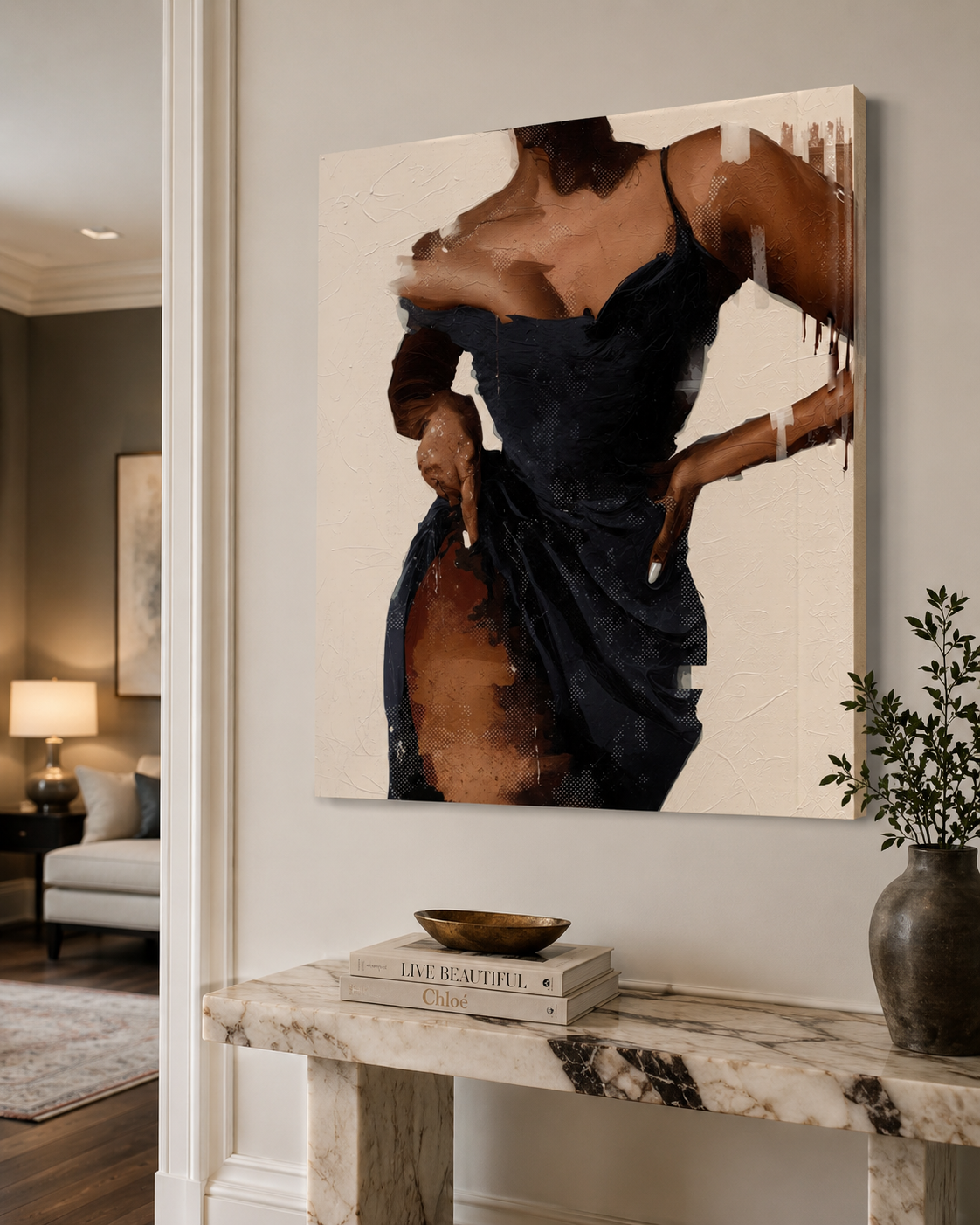 A large vertical canvas wall art print depicting an abstract portrait of a woman in a dark navy dress, displayed on a light gray wall above a marble console table in a modern living room setting.