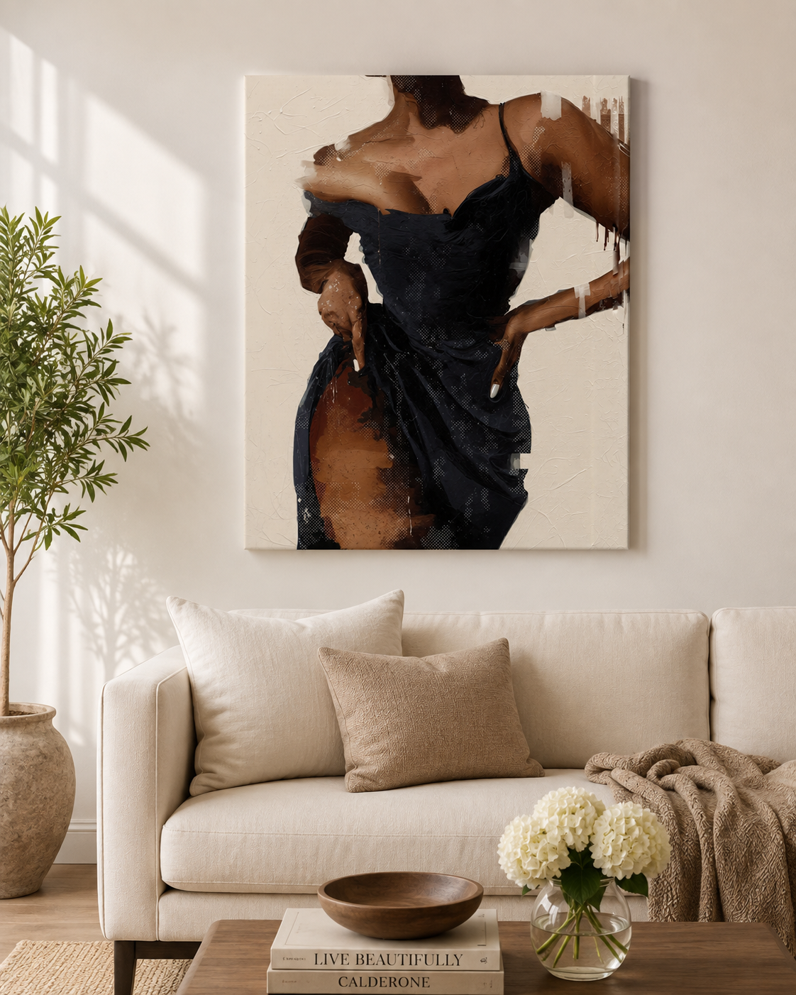 A vertical canvas wall art print featuring an abstract painting of a woman in a dark dress, displayed on a beige wall above a modern cream sofa in a styled living room.
