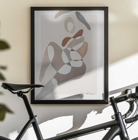 Flowing Silhouettes by Sella Molenaar — black-framed canvas displayed behind a bicycle