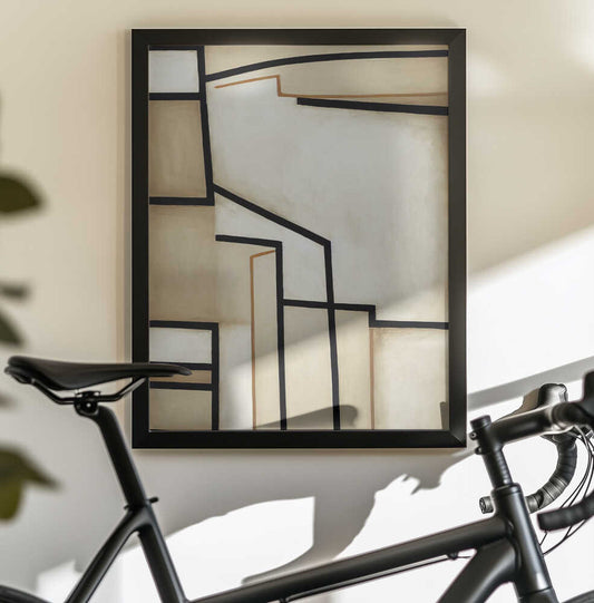Geometric Abstract by Bilge Paksoylu, black-framed artwork above a bicycle; cream geometric panels divided by black angular lines.