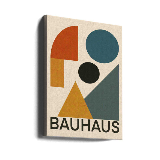 Geometric Bauhaus Composition by Little Dean, gallery-wrapped canvas viewed at an angle; blue and black circles with rust and gold shapes and BAUHAUS lettering.