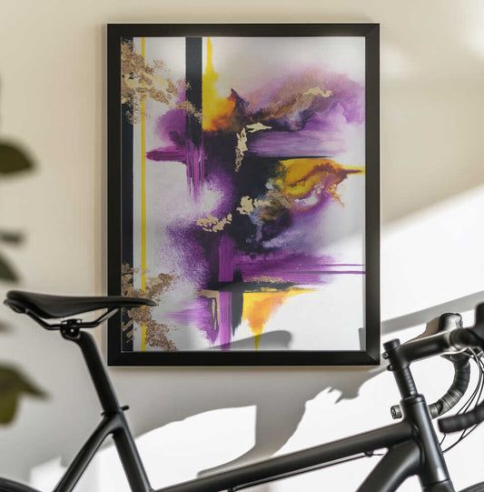 Geometric Purple and Yellow by Alyson Storms, black-framed artwork above a bicycle; purple and yellow brush-like bursts crossed by black lines.