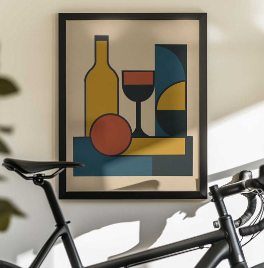 Geometric Still Life Composition by Little Dean: black-framed art above a bicycle, showing a yellow bottle and stemmed wine glass with a red circle and blue and black geometric forms.