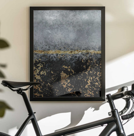Gold Black Abstract by Bilge Paksoylu — black-framed canvas displayed behind a bicycle