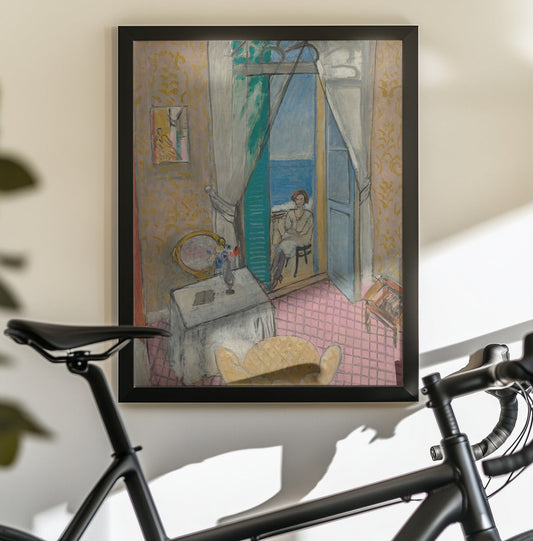 Interieur a Nice by Henri Matisse — black-framed canvas displayed behind a bicycle