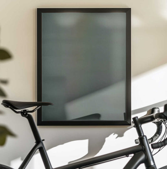 Lasting Remedy by Mark Russell Jones — black-framed canvas displayed behind a bicycle