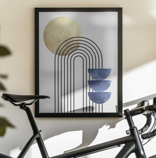 Lines and Circles by Vitor Costa, black-framed artwork above a bicycle; nested black arches with a gold-toned circle and three stacked blue semicircles.