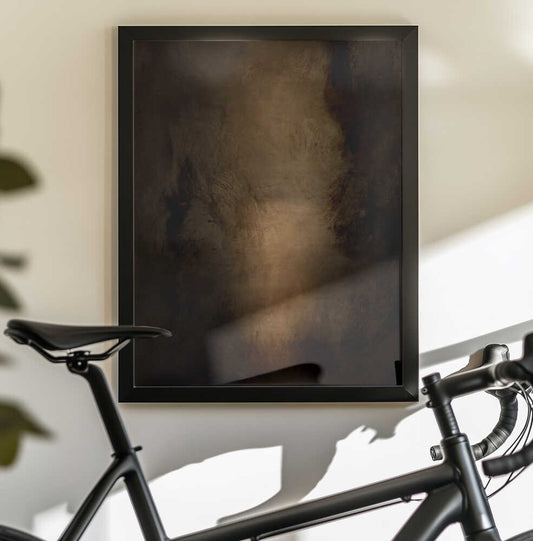 Moods Abstract by Dan Hobday — black-framed canvas displayed behind a bicycle