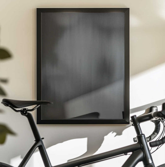 Of Otherworldly Terrain by Mark Russell Jones — black-framed canvas displayed behind a bicycle