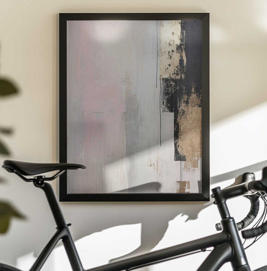 Pink abstraction by Sally Ann Moss, black-framed artwork above a bicycle; pale pink abstraction beside black and gold-toned brush marks.