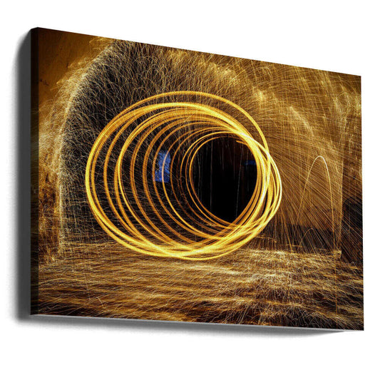 Playing with fire by Milan Uhrin AFIAP AZSF, gallery-wrapped canvas viewed at an angle; looping golden light trails surrounded by fine sparks.