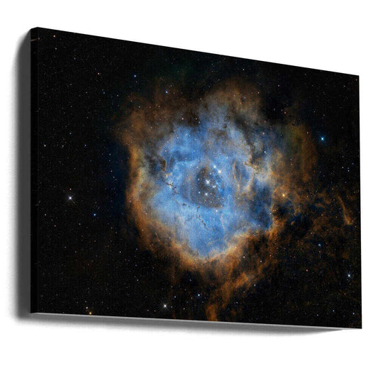 Rosette by Vikas Chander, gallery-wrapped canvas viewed at an angle; a luminous blue cloud ring edged with warm gold tones in a dark star field.
